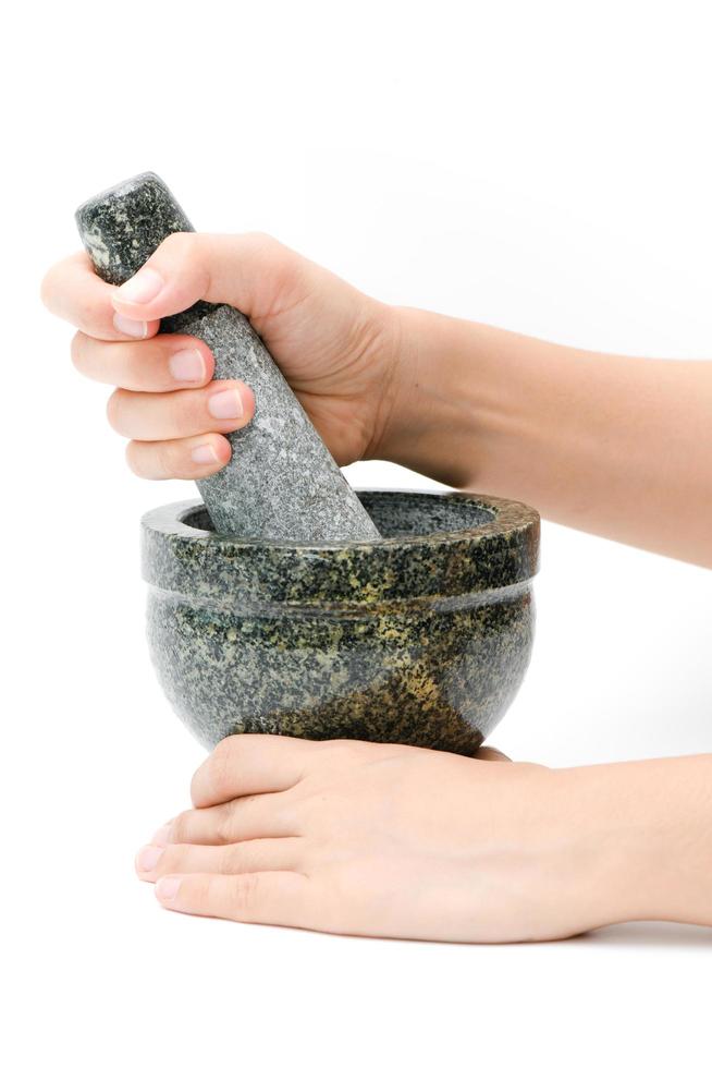 Granite mortar with woman hands photo