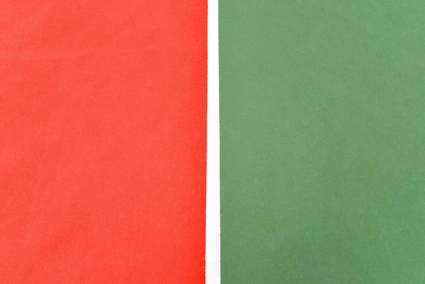 Green and red floor colorful painted on court sport outdoors with white line background photo