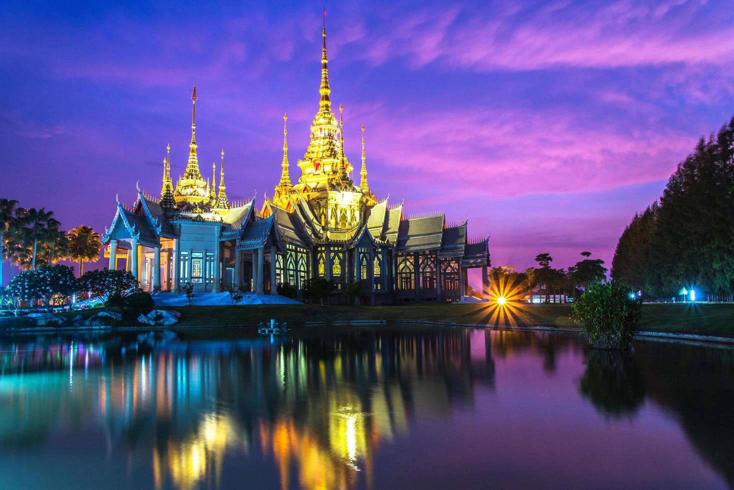 beautiful temple thailand dramatic colorful sky twilight sunset shadow on water reflection with light photo