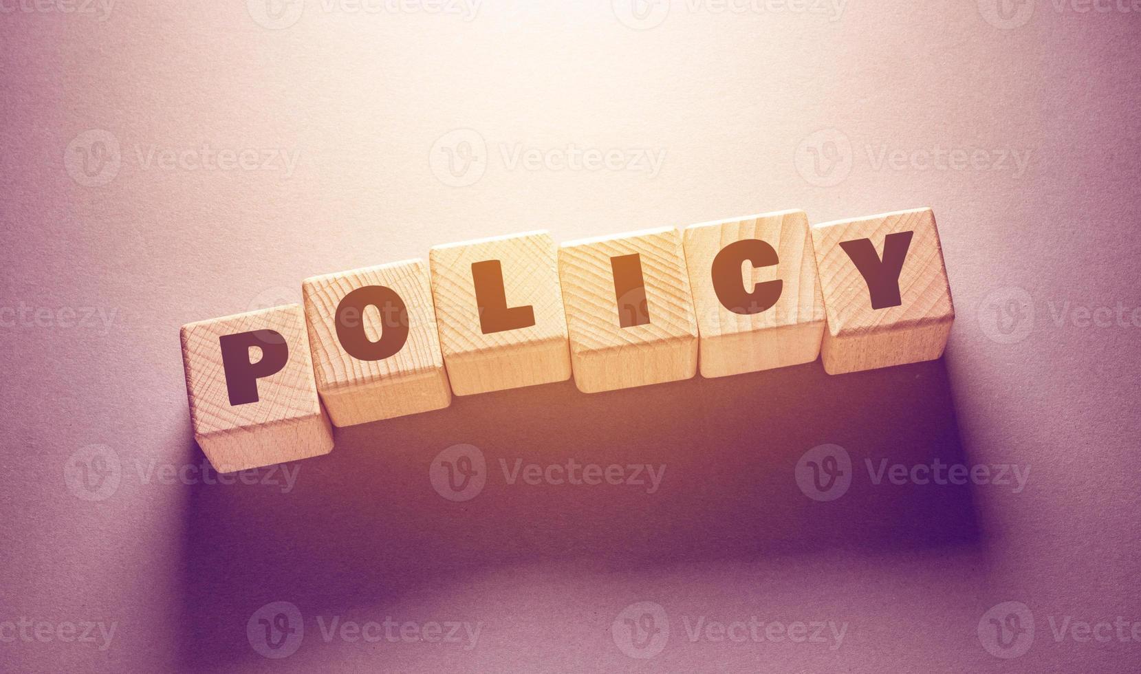 policy Word with Wooden Cubes photo