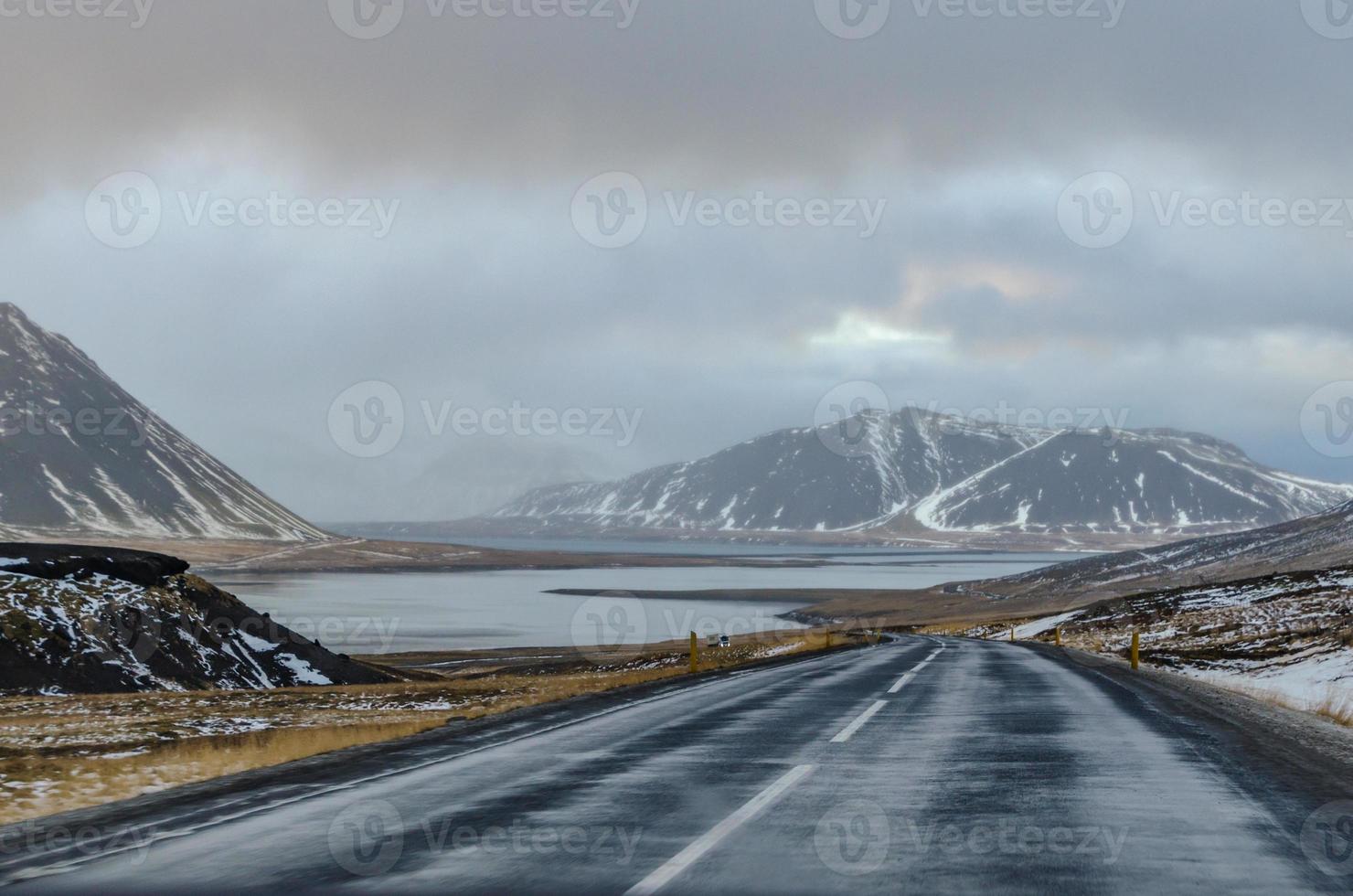Driving through Iceland on a cold and rainy winter day, every curve in the road reveals views of epic proportions, be they mountains, fjords, or valleys. photo