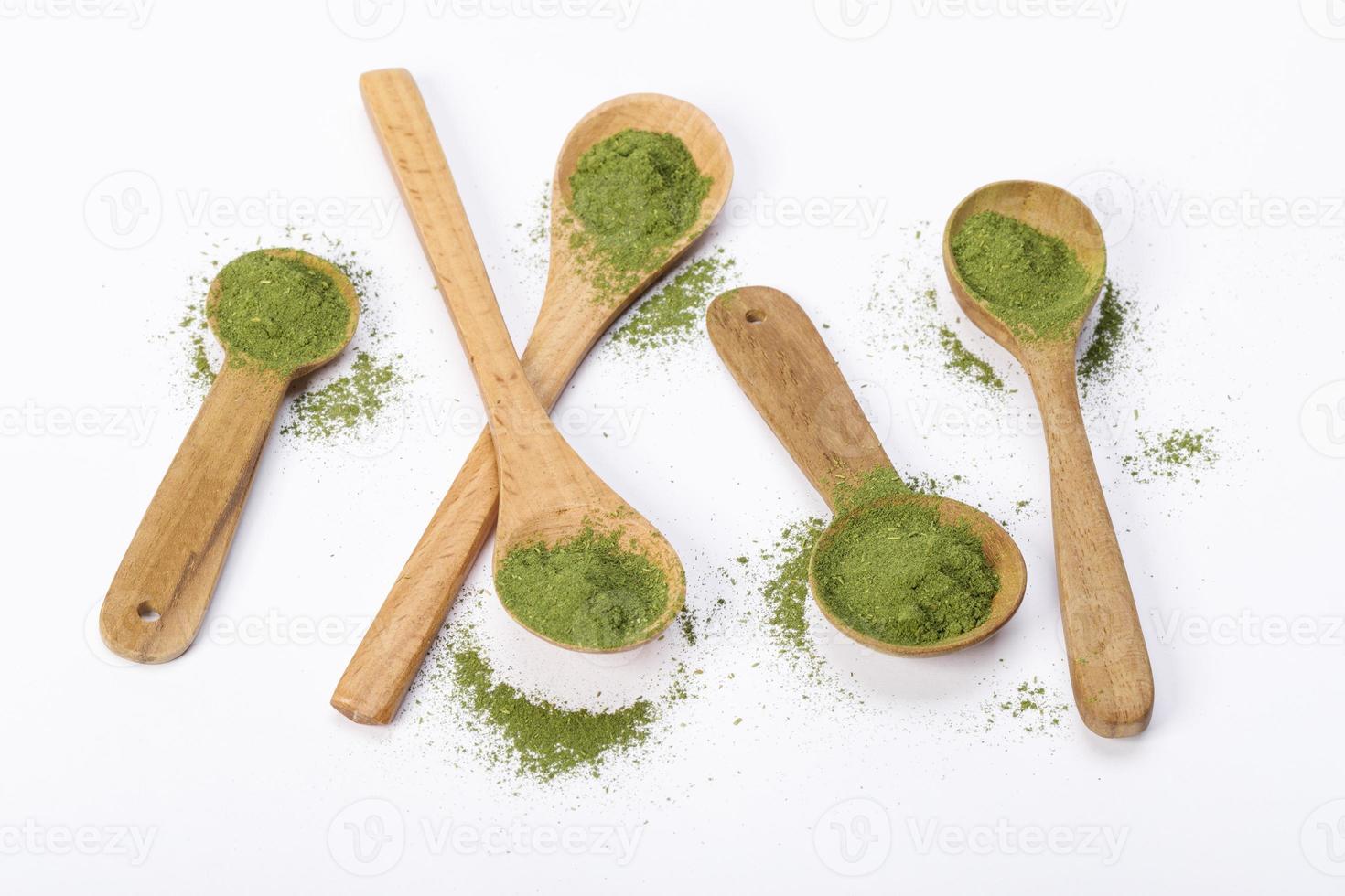 Matcha green tea powder in spoons isolated on white background creative flat lay, Organic product from the nature for healthy with traditional style photo