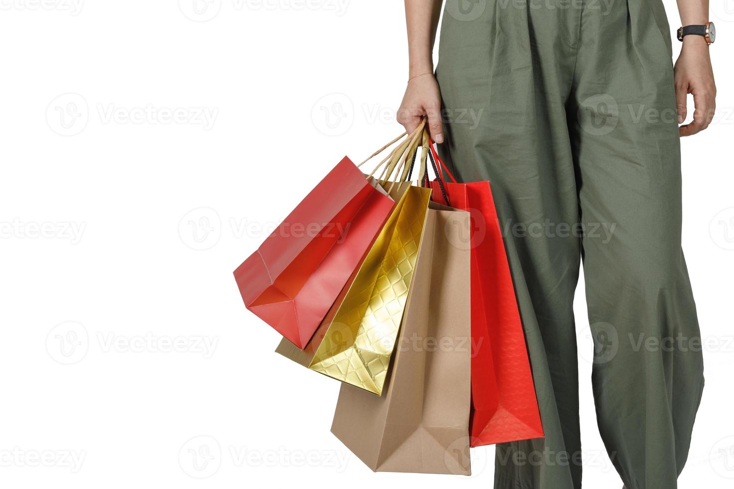 Shopping woman holding shopping bags, isolated on white studio background with copy space, E-commerce digital marketing lifestyle concept photo