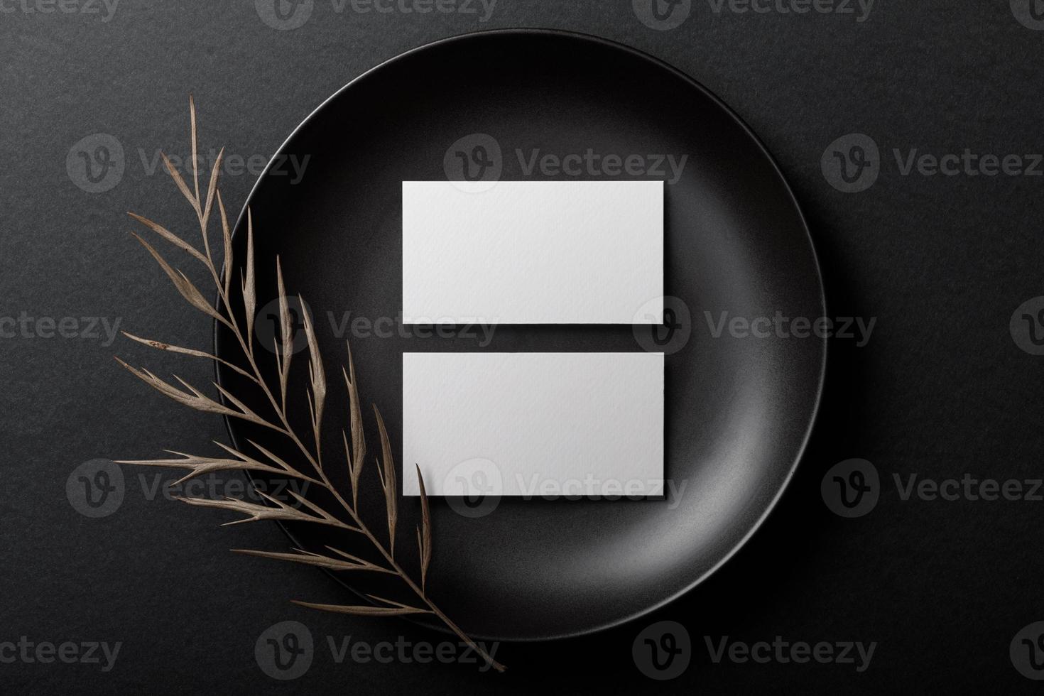 Minimal business card mockup on black plate photo