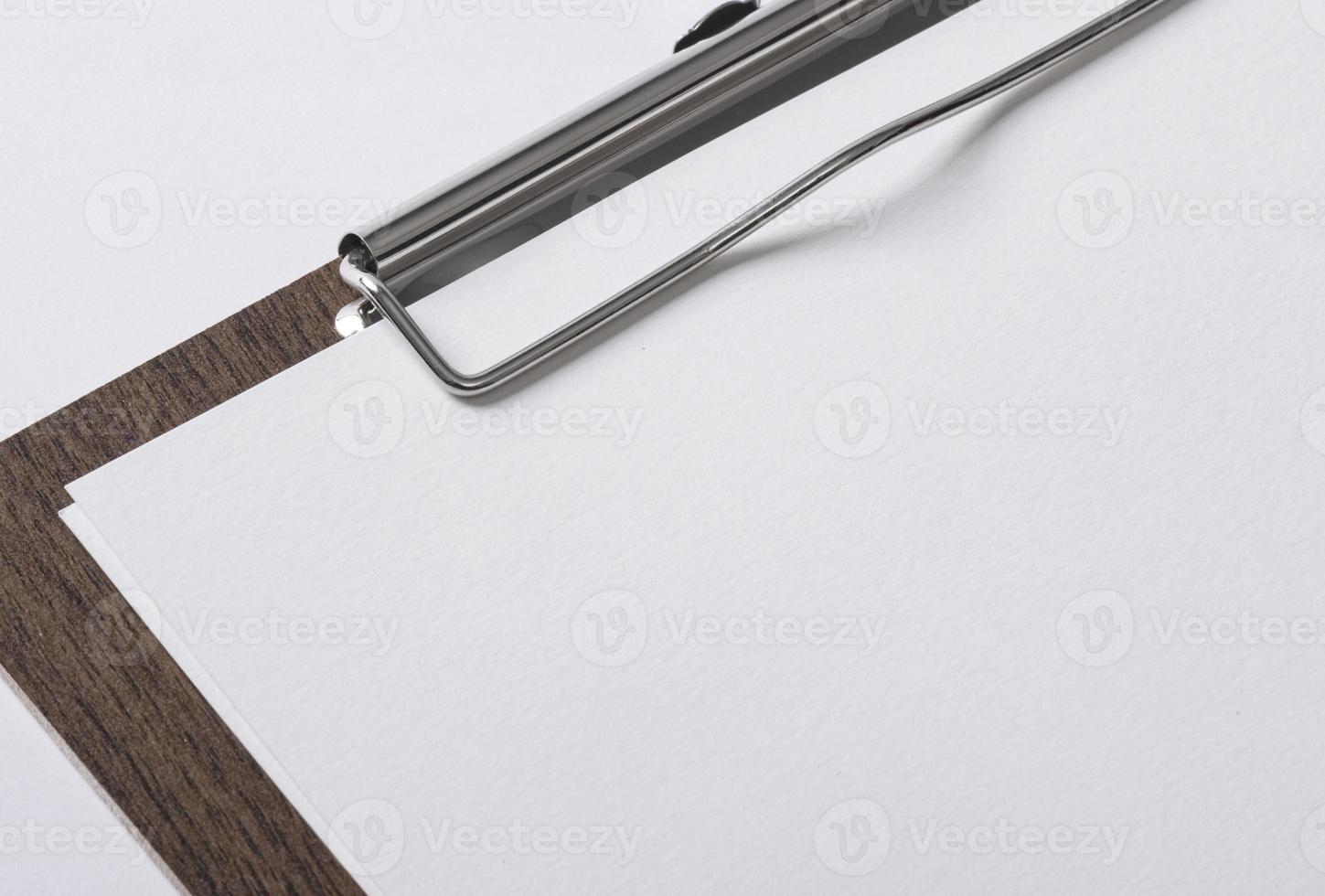 A4 paper on wooden file with copy space for your logo or graphic design photo