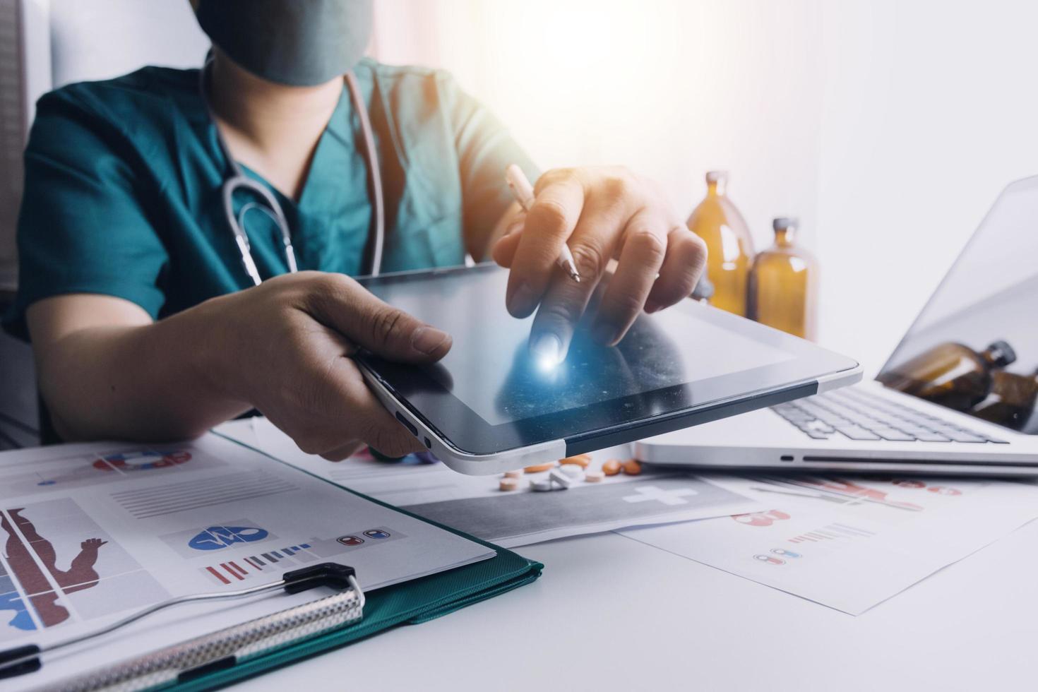 Medicine doctor and stethoscope touching icon medical network connection with modern interface on digital tablet in hospital background. Medical technology network concept photo
