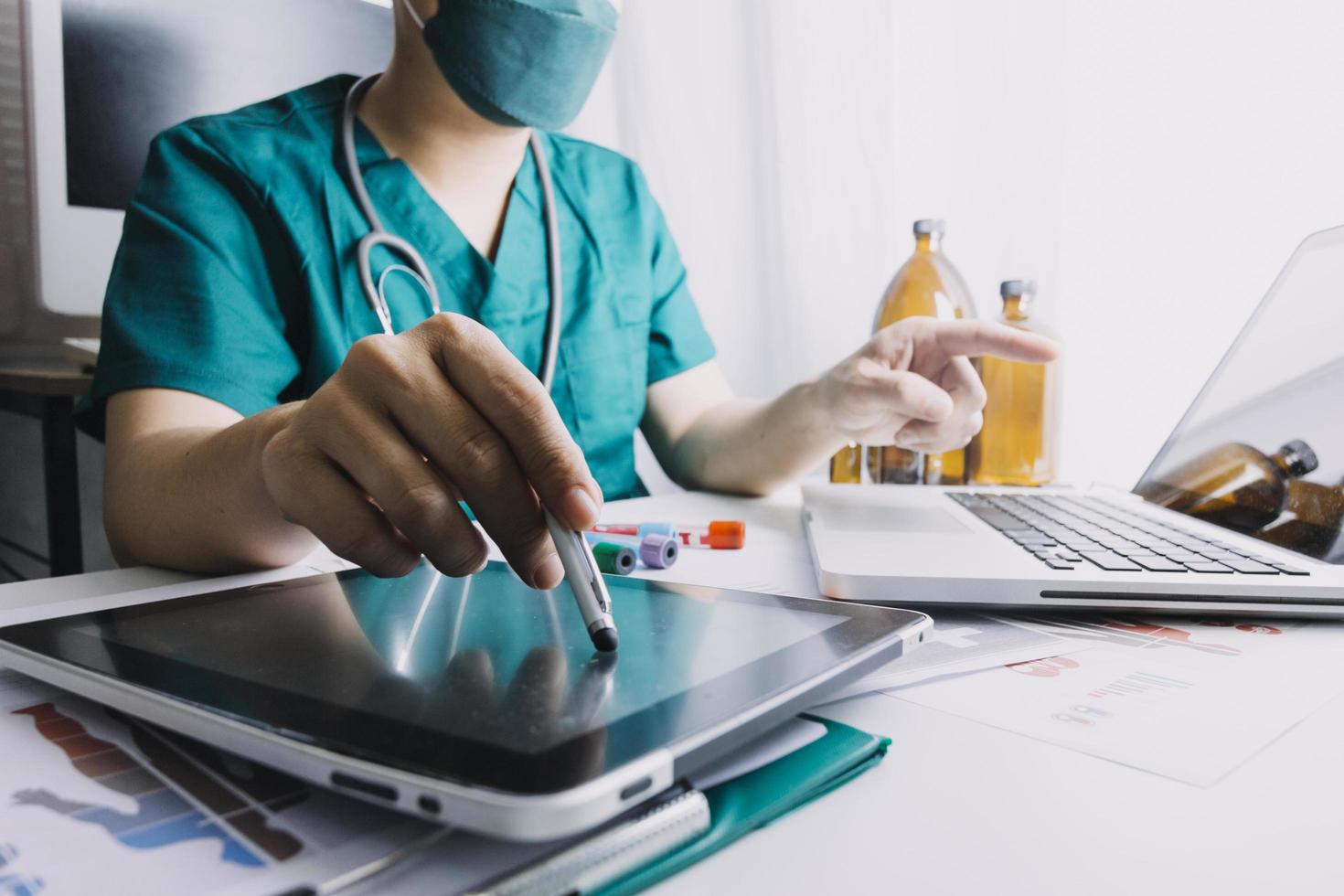 Medicine doctor and stethoscope touching icon medical network connection with modern interface on digital tablet in hospital background. Medical technology network concept photo