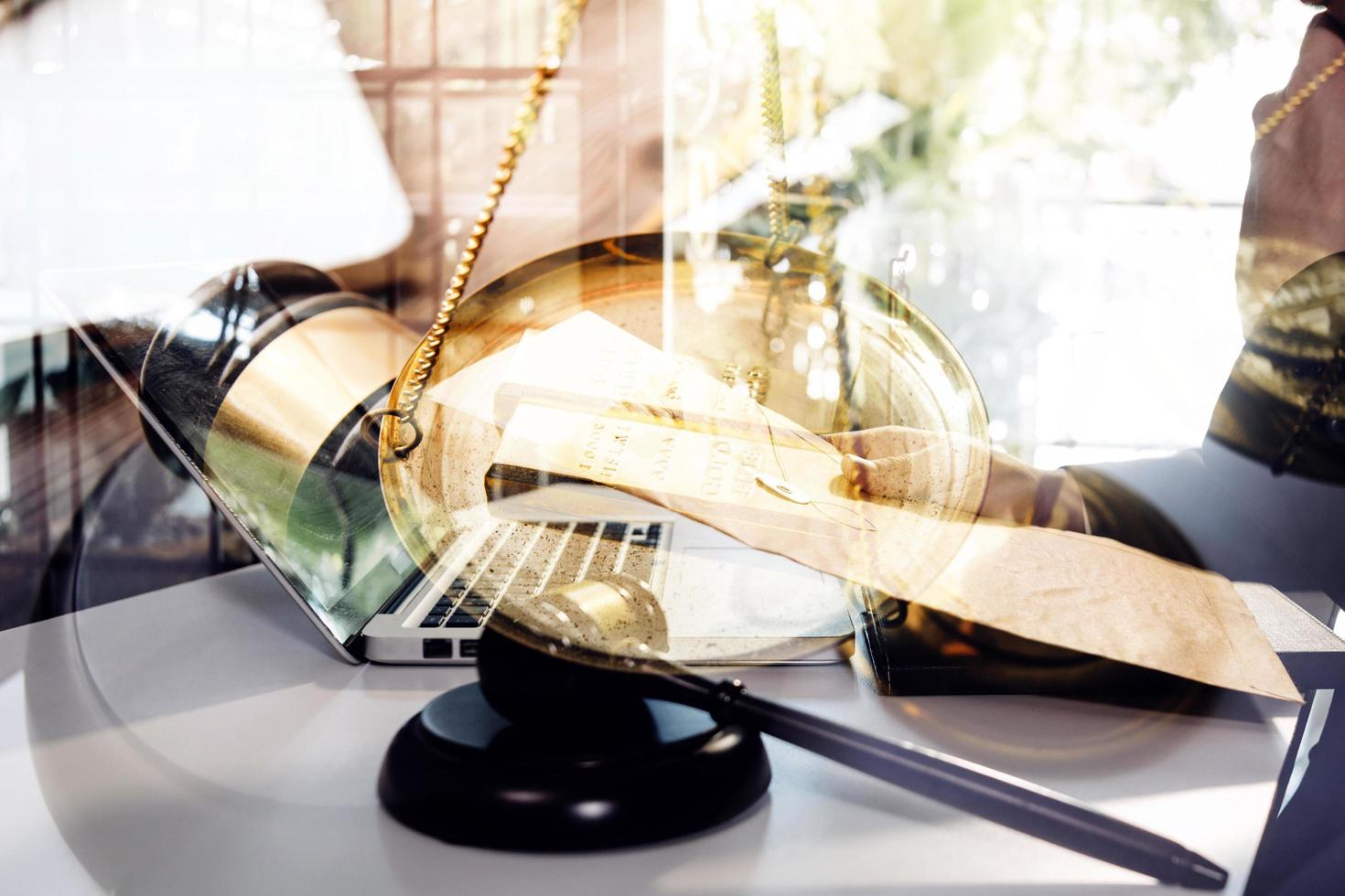 Business and lawyers discussing contract papers with brass scale on desk in office. Law, legal services, advice, justice and law concept picture with film grain effect photo