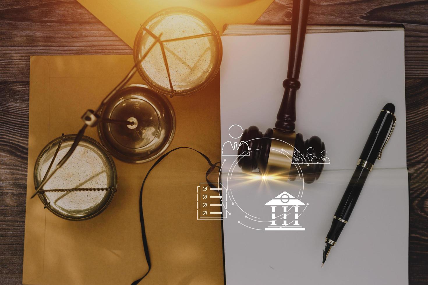 Justice and law concept.Male judge in a courtroom with the gavel, working with, computer and docking keyboard, eyeglasses, on table in morning light photo
