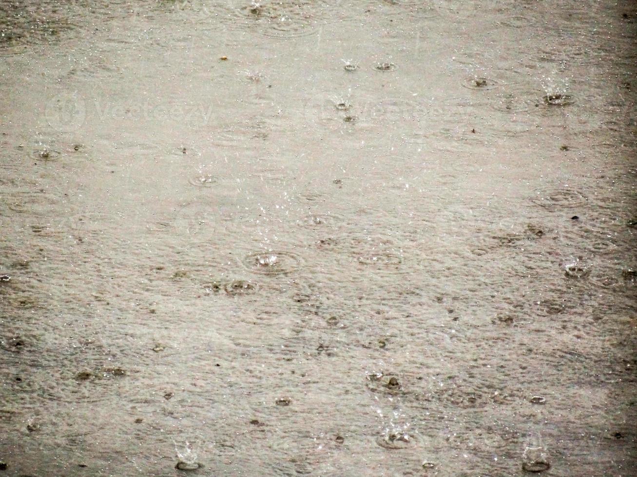 Drops of rain against the concrete photo