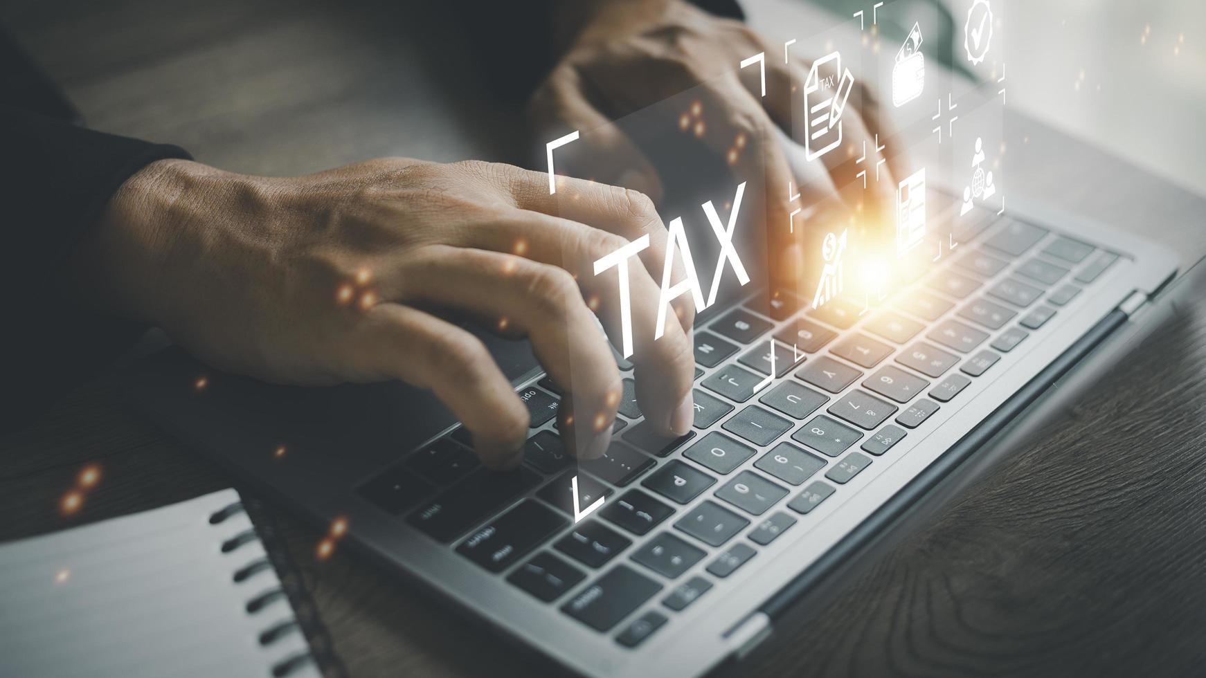 Busines using a computer to complete Individual income tax return form online for tax payment. Government, state taxes. Data analysis, paperwork, financial research, report. Calculation tax return. photo