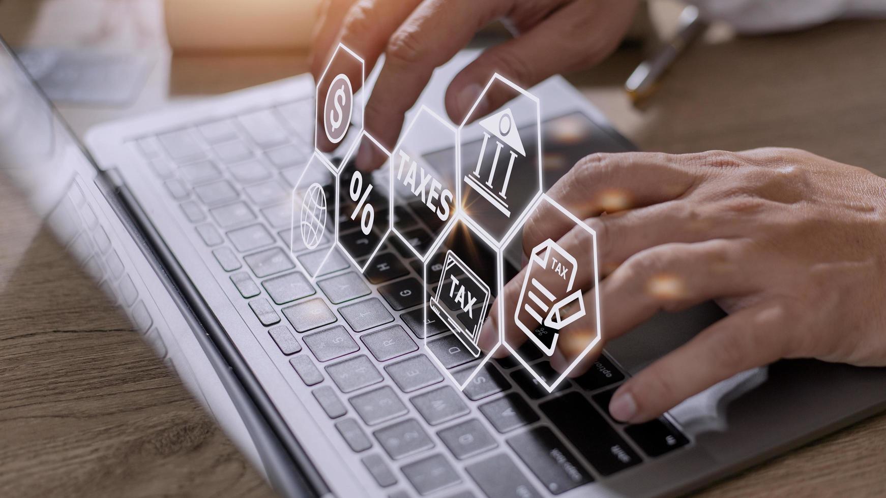 Busines using a computer to complete Individual income tax return form online for tax payment. Government, state taxes. Data analysis, paperwork, financial research, report. Calculation tax return. photo