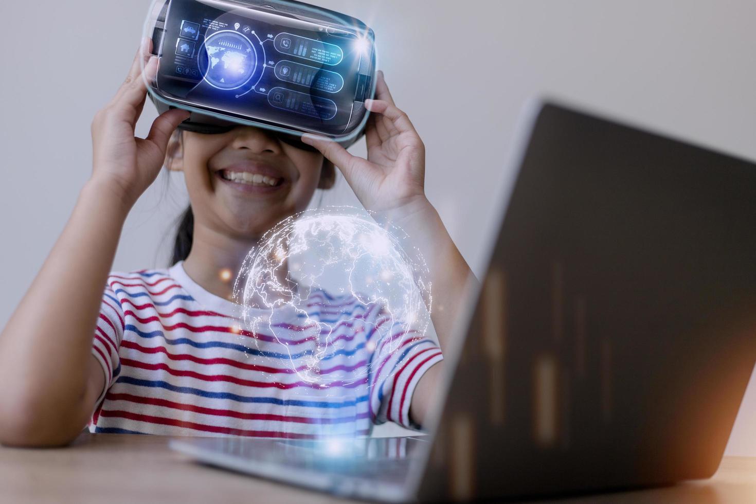 Child using virtual reality headset for metaverse, a kid looking in VR glasses. Young person with futuristic goggles having fun. Technology, simulator and future concept. photo