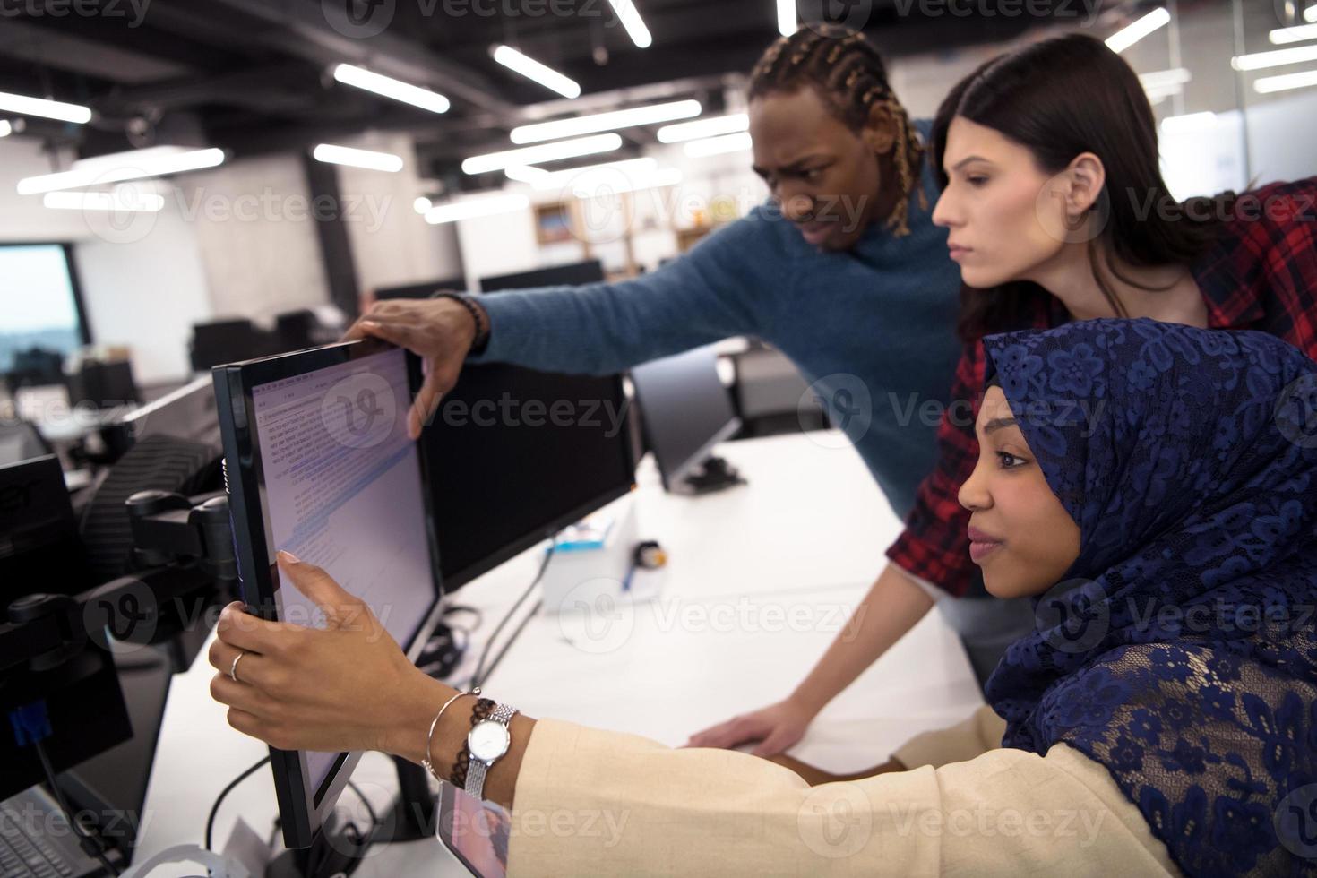 multiethnics team of software developers working together photo