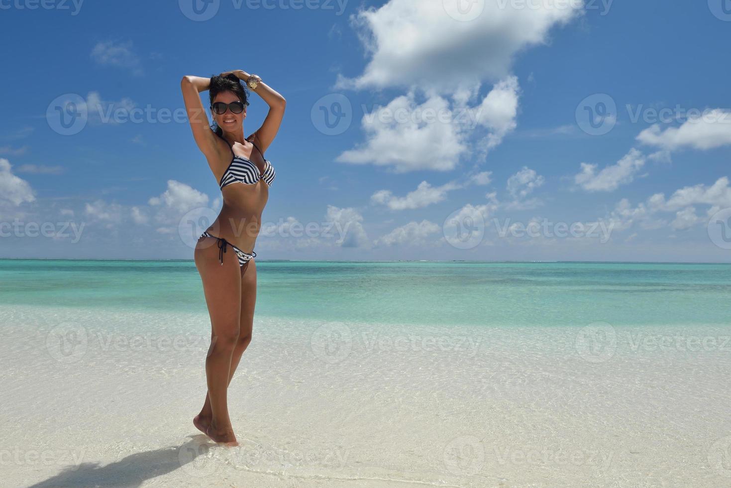 beautiful young woman  on beach have fun and relax photo
