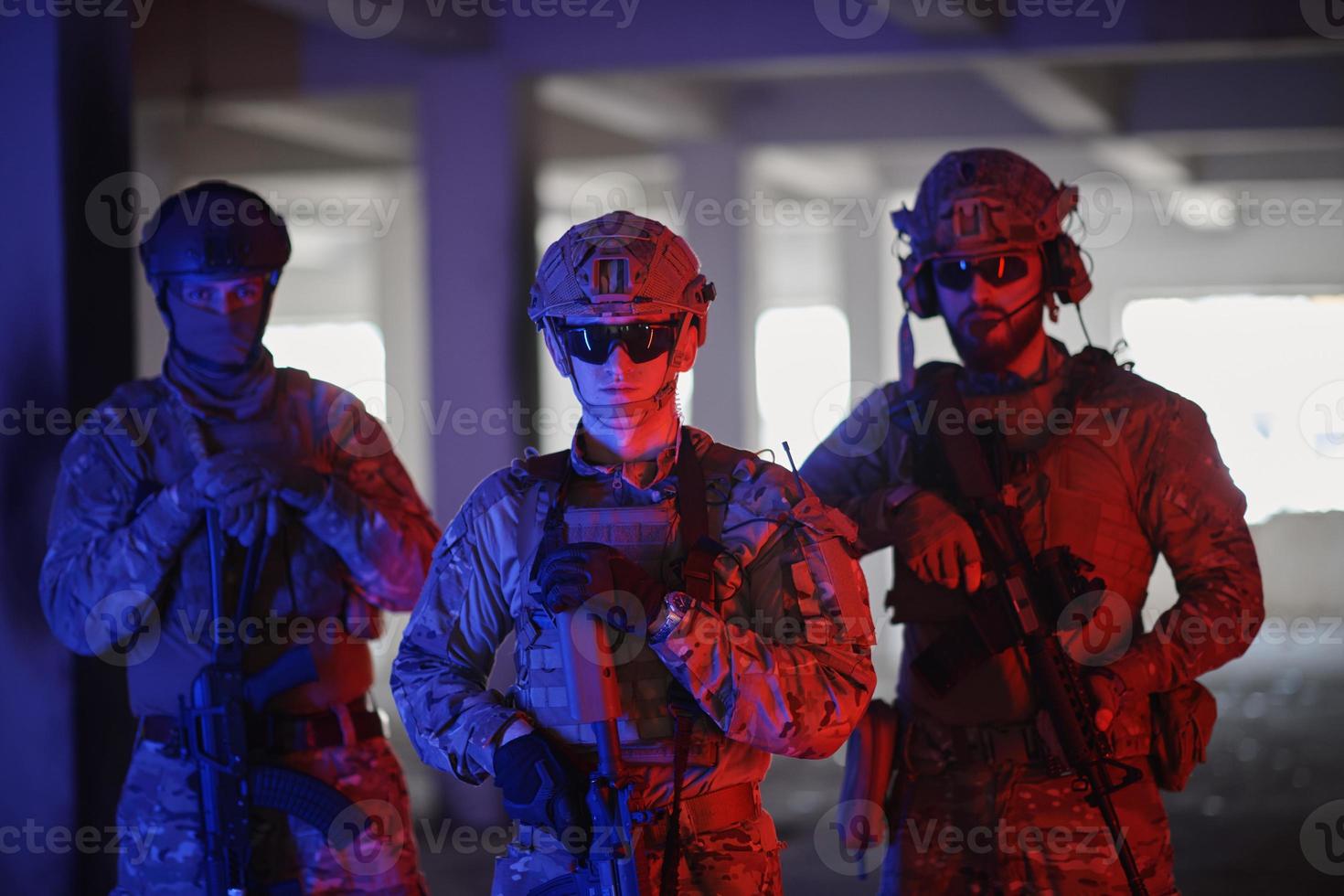 soldier squad team portrait in urban environment colored lightis photo