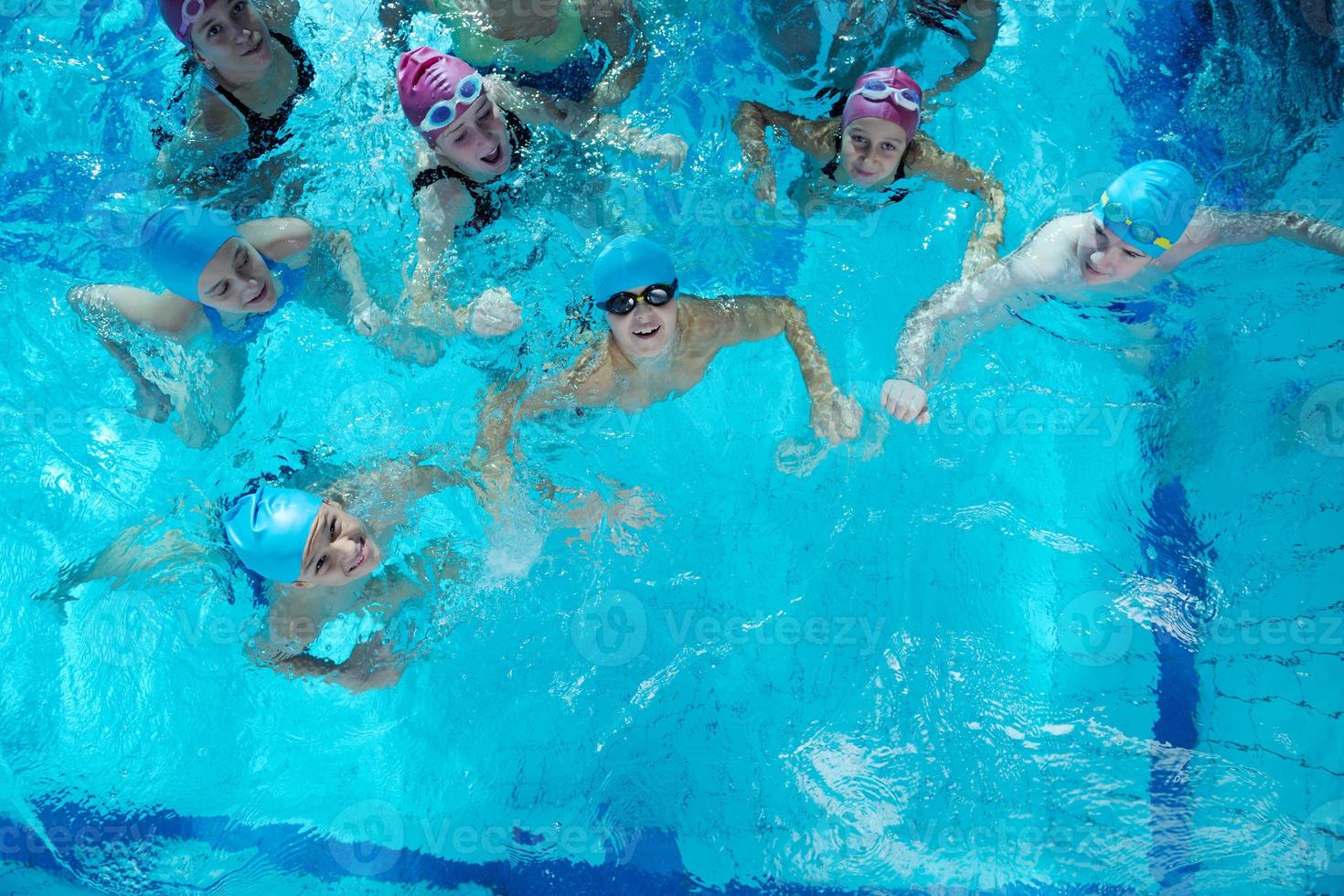 happy childrens at swimming pool photo