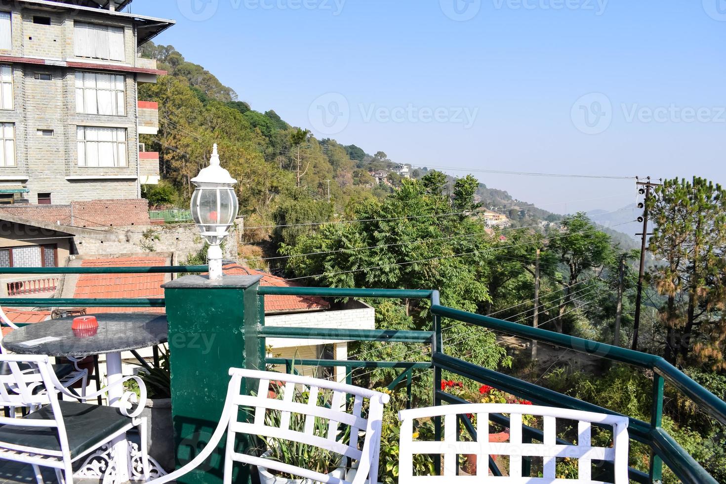 Early morning view of Modern rooftop restaurant at Kasauli, Himachal Pradesh in India, View of mountain hills from open air restaurant in Kasauli, Kasauli Rooftop restaurant photo