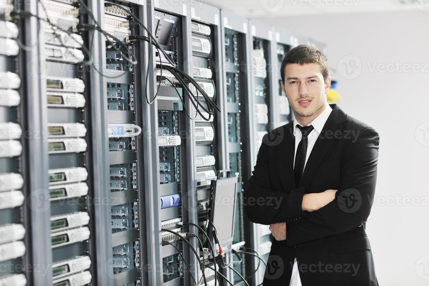 young it engeneer in datacenter server room photo