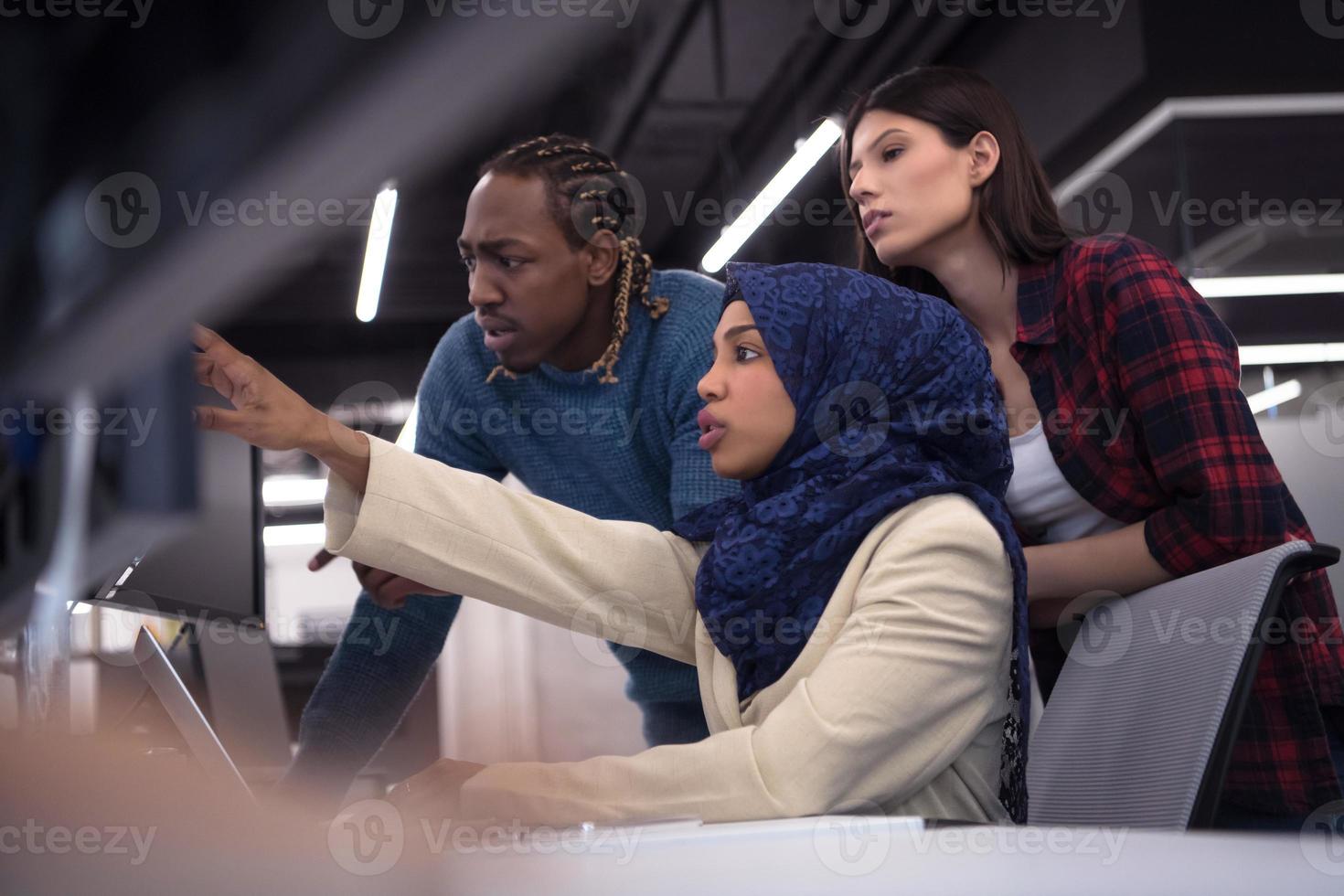 multiethnics team of software developers working together photo