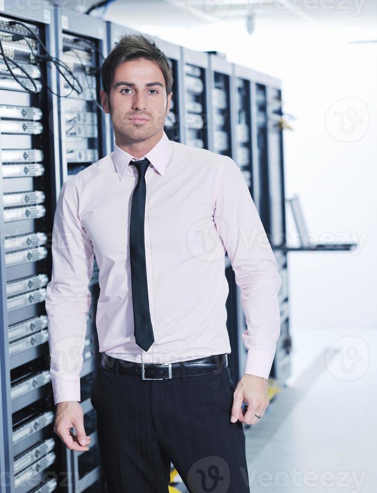young it engeneer in datacenter server room photo