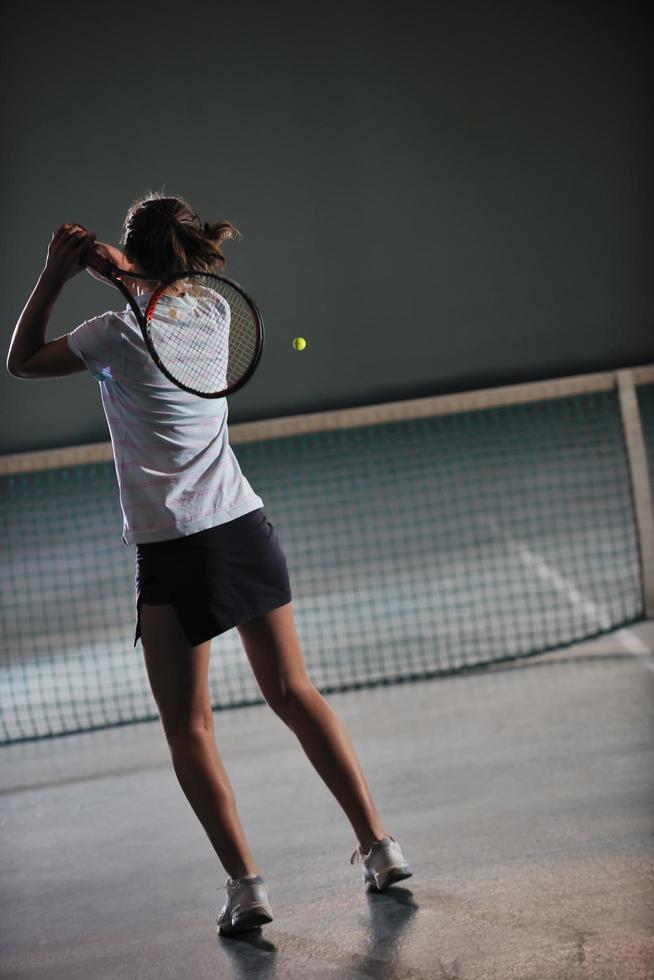 Playing tennis indoors photo