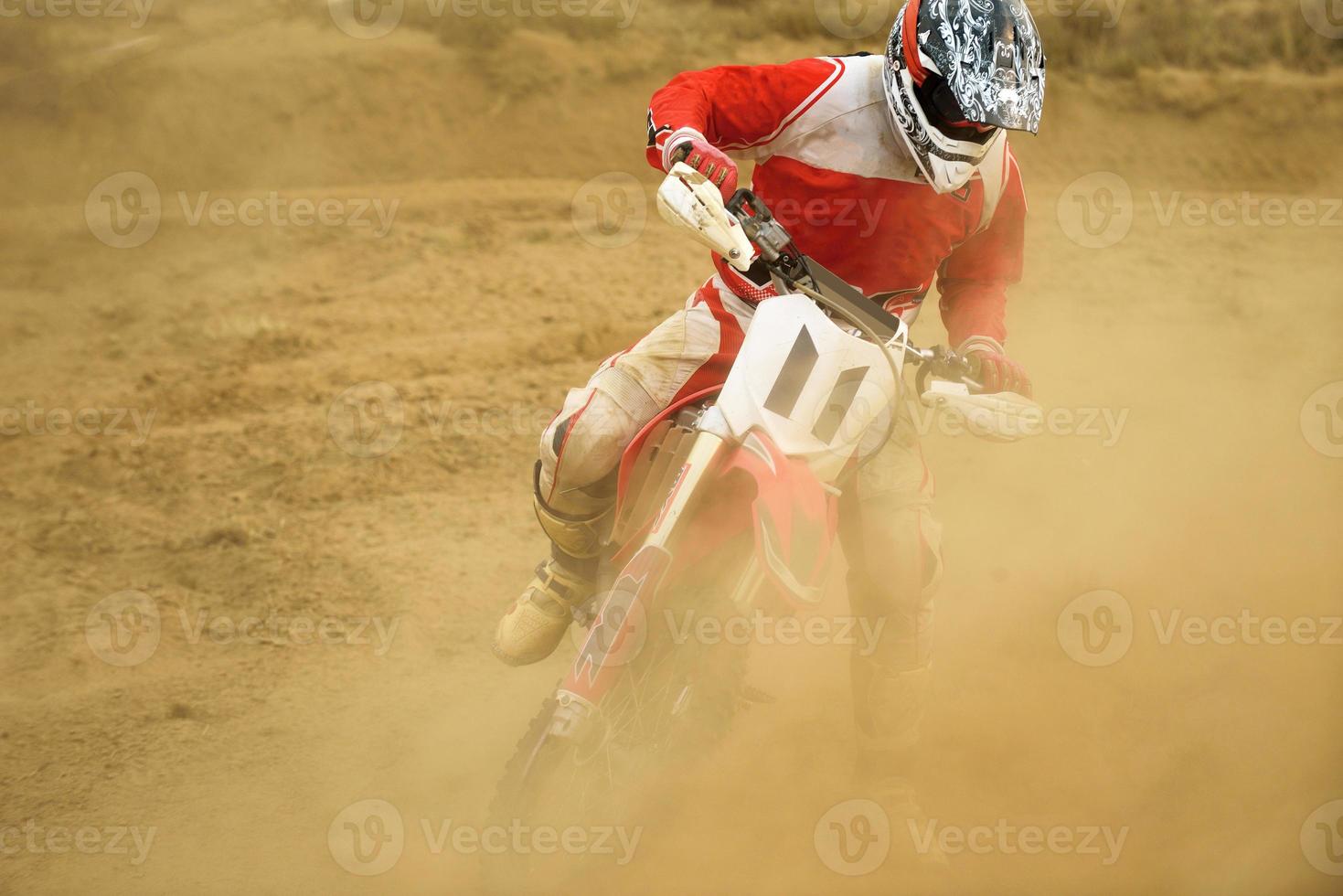 Riding a motocross bike photo