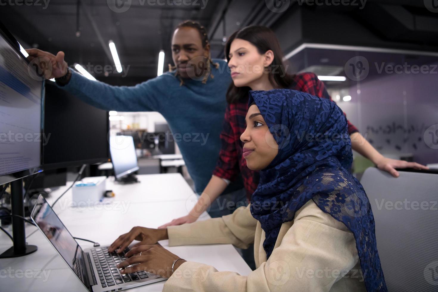multiethnics team of software developers working together photo