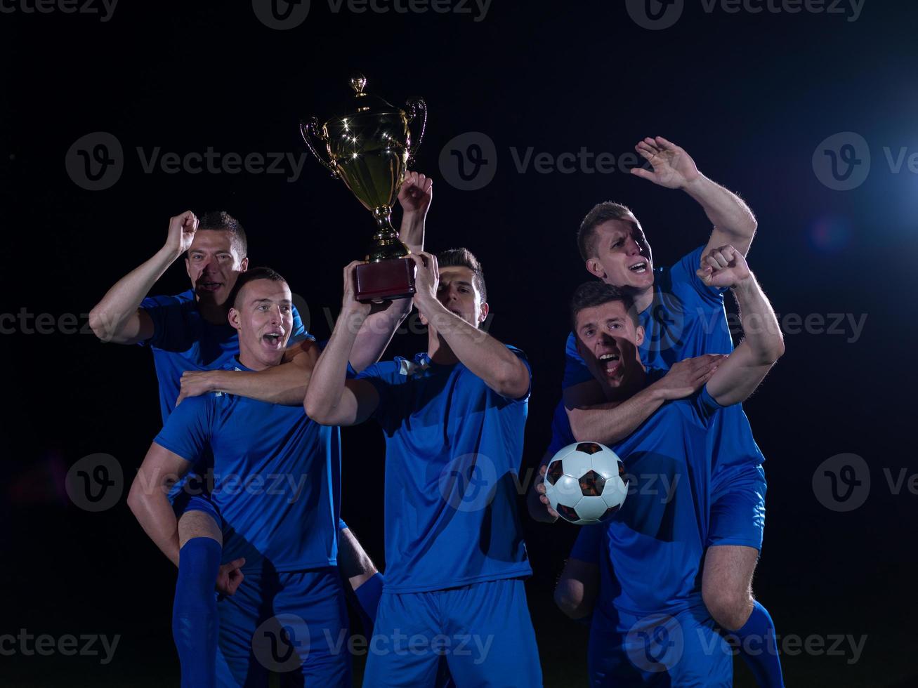 soccer players celebrating victory photo