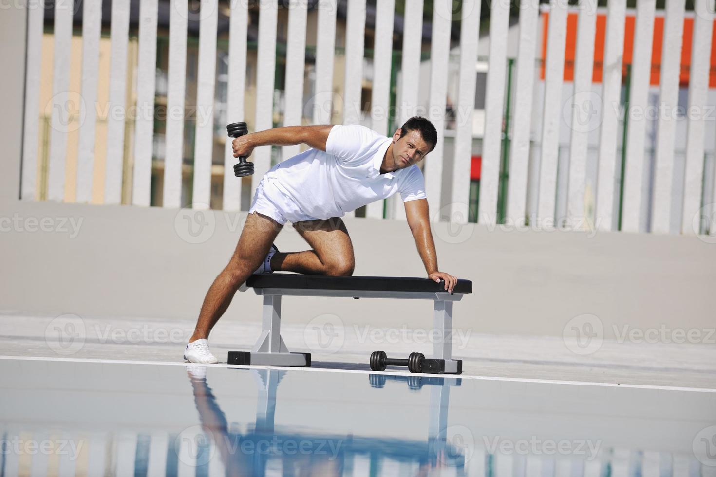 Exercising by pool photo