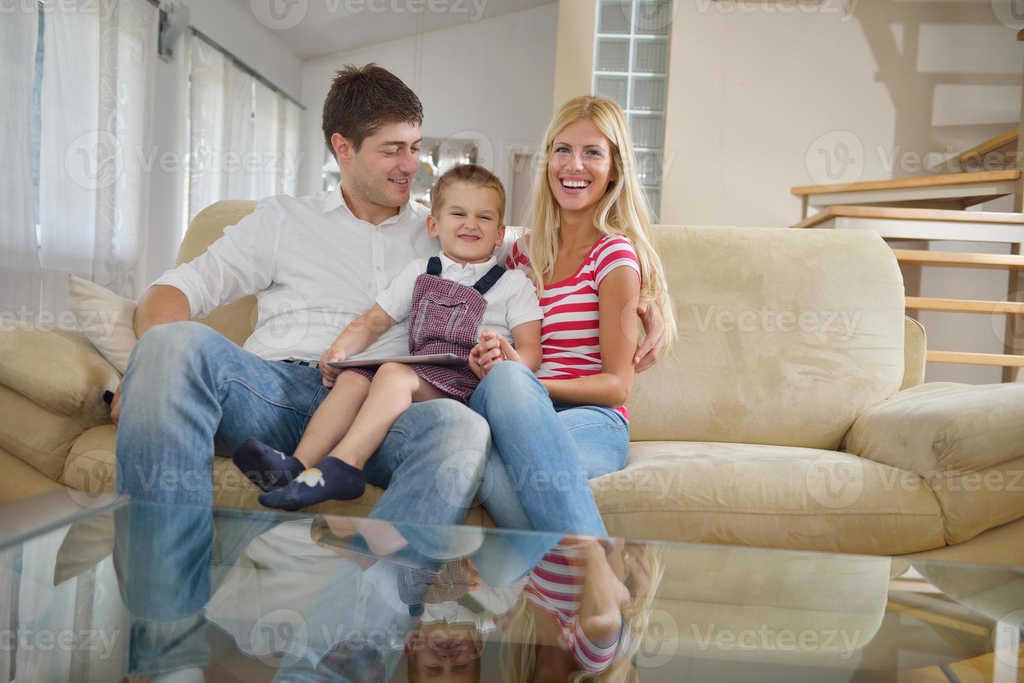 family at home using tablet computer photo