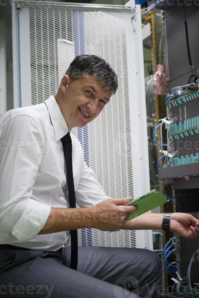 network engineer working in  server room photo