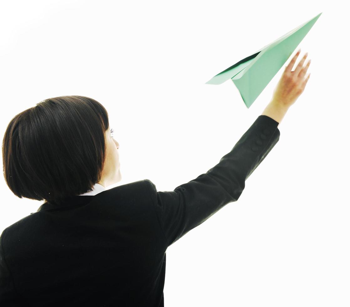 business woman throwing  paper airplane photo