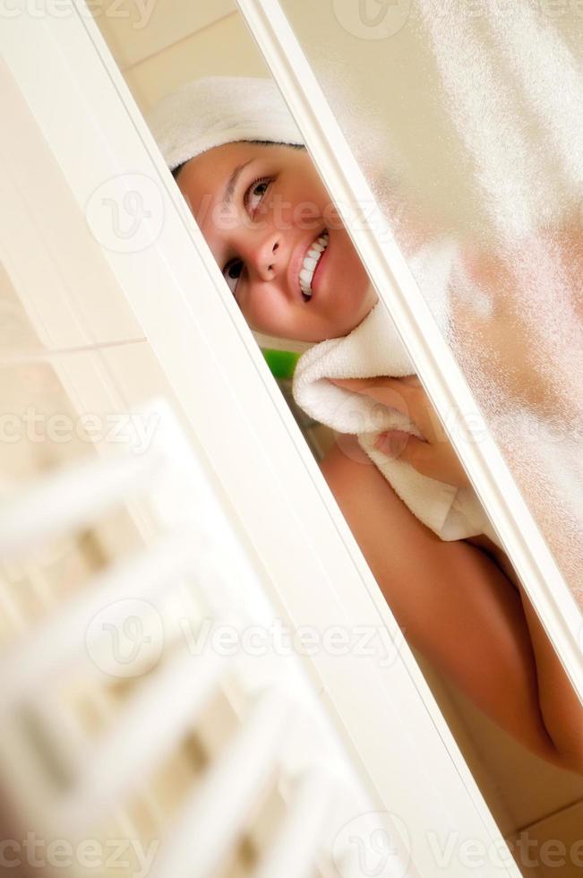 Woman taking shower photo