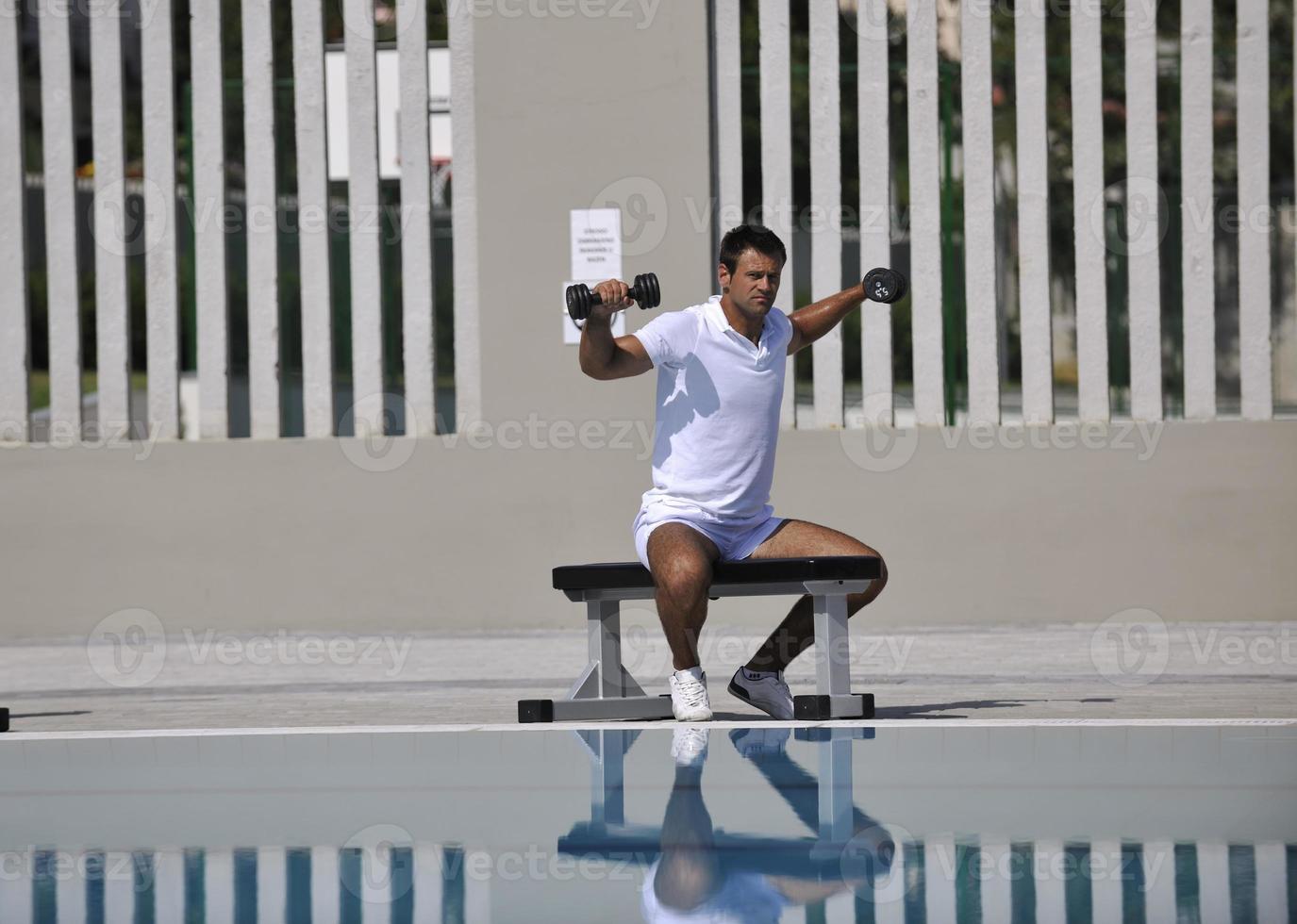 Exercising by pool photo