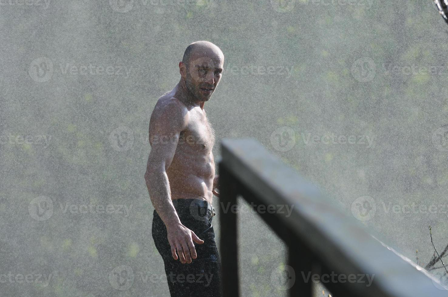 Man in waterfall photo