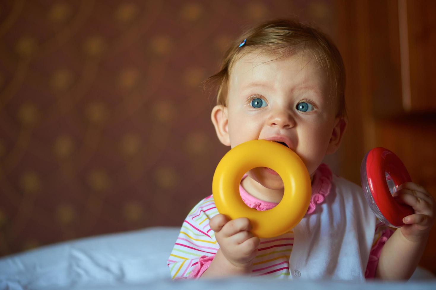 baby playing with toys at home photo