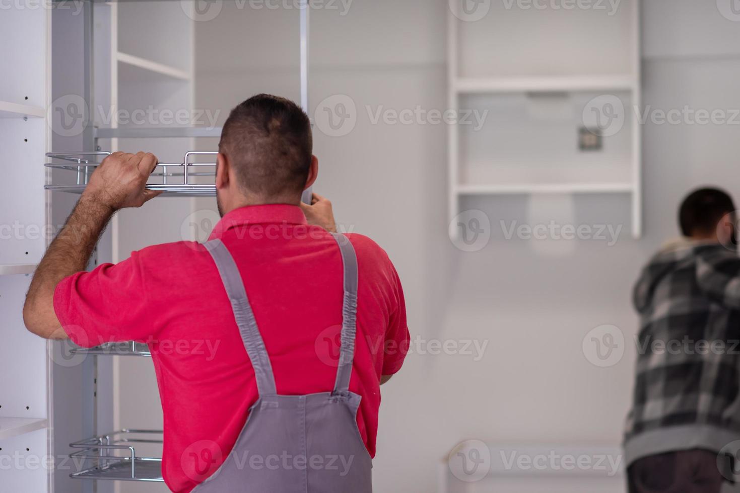 workers installing a new kitchen photo