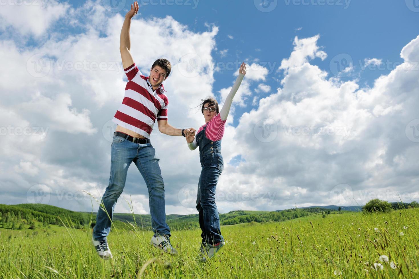 Portrait of romantic young couple smiling together outdoor photo