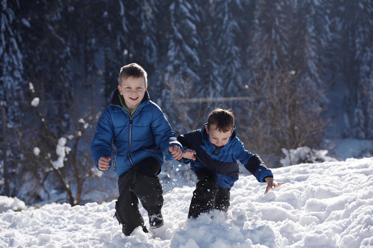 kids playing with  fresh snow photo