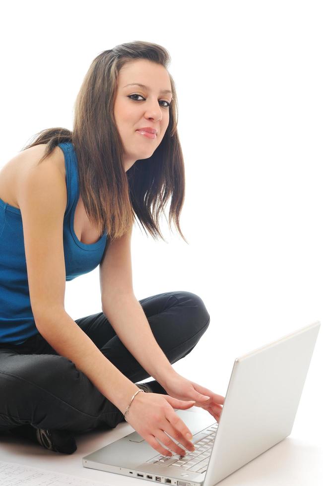 one young girl work on laptop isolated on white photo