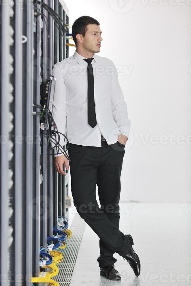 young it engeneer in datacenter server room photo