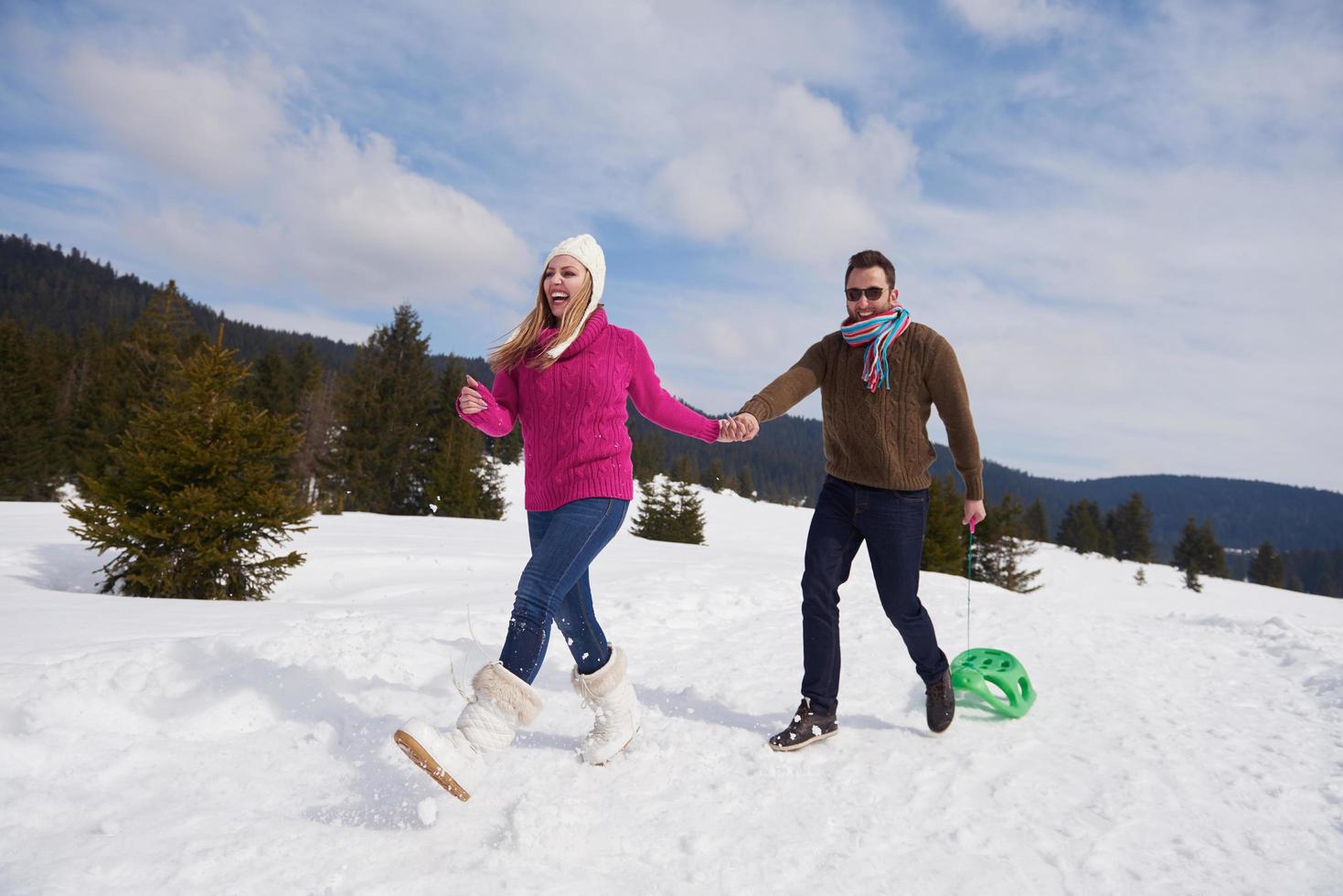 happy young couple having fun on fresh show on winter vacation photo