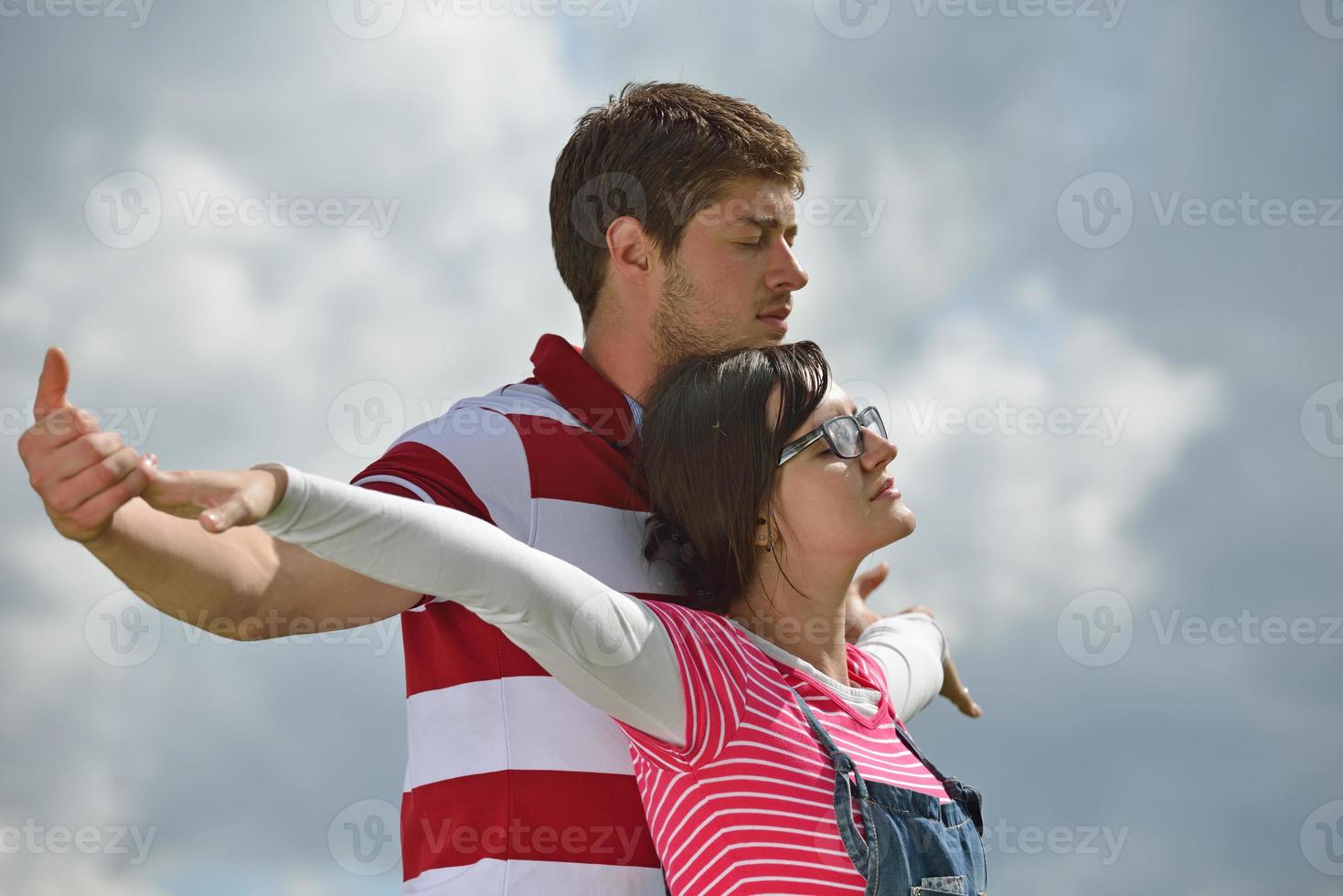 Portrait of romantic young couple smiling together outdoor photo