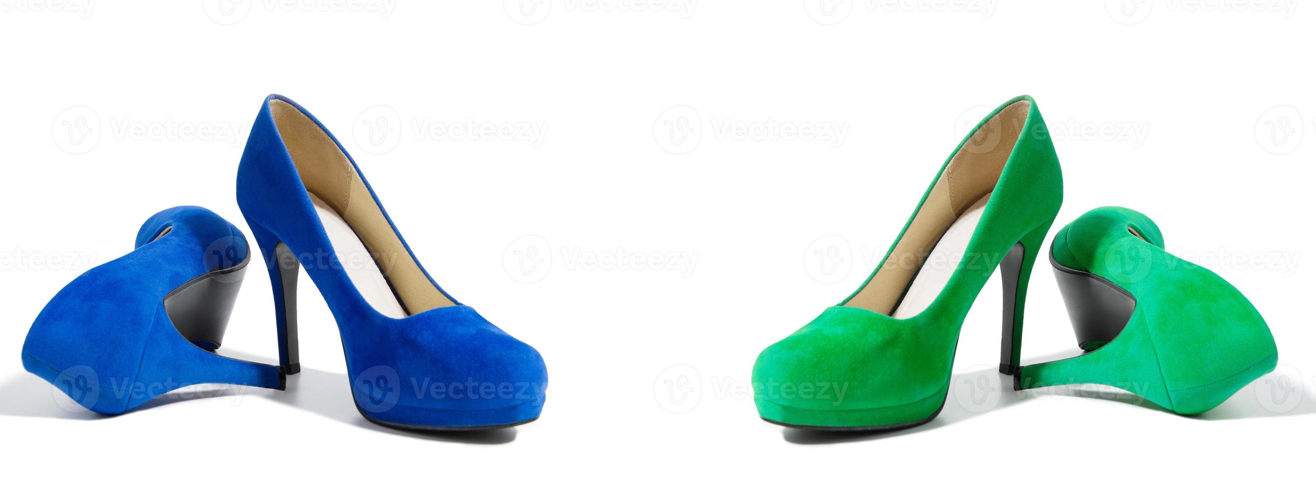 Closeup of fashionable high heels shoes isolated on white background. Green and blue color woman shoe on floor. Shopping and fashion concept. Copy space. Selective focus photo
