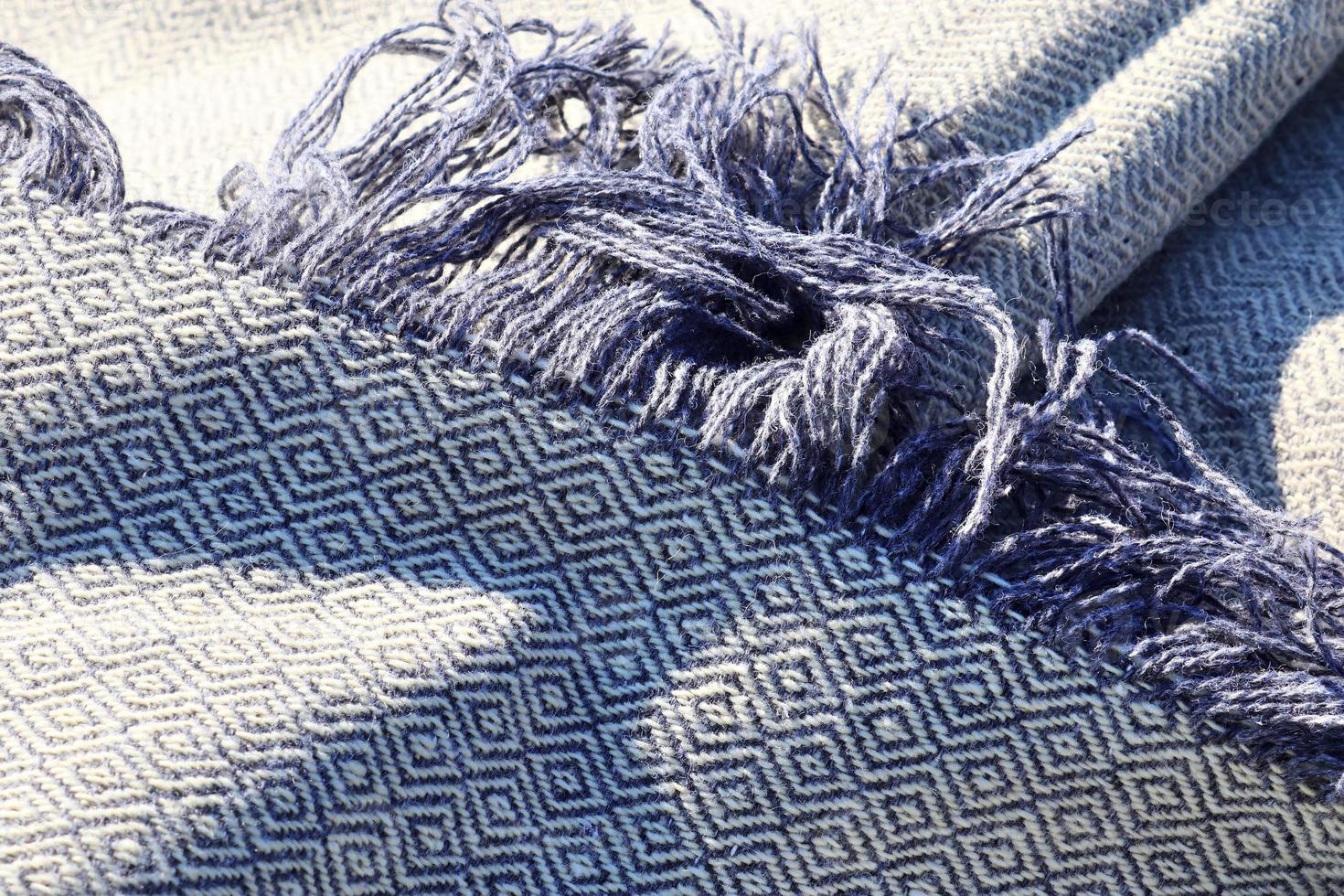 Detailed close up view on samples of cloth and fabrics in different colors found at a fabrics market photo