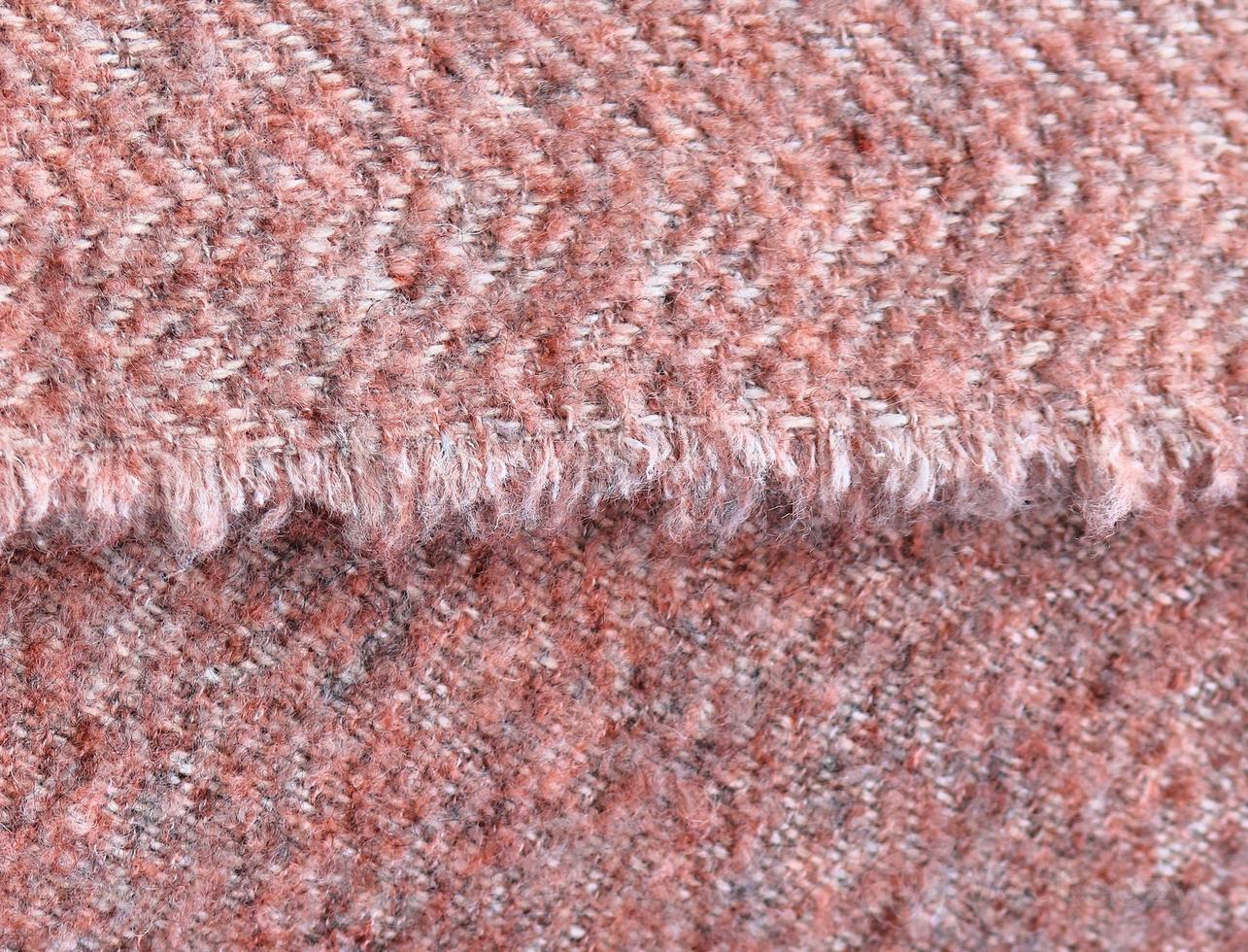 Detailed close up view on samples of cloth and fabrics in different colors found at a fabrics market photo