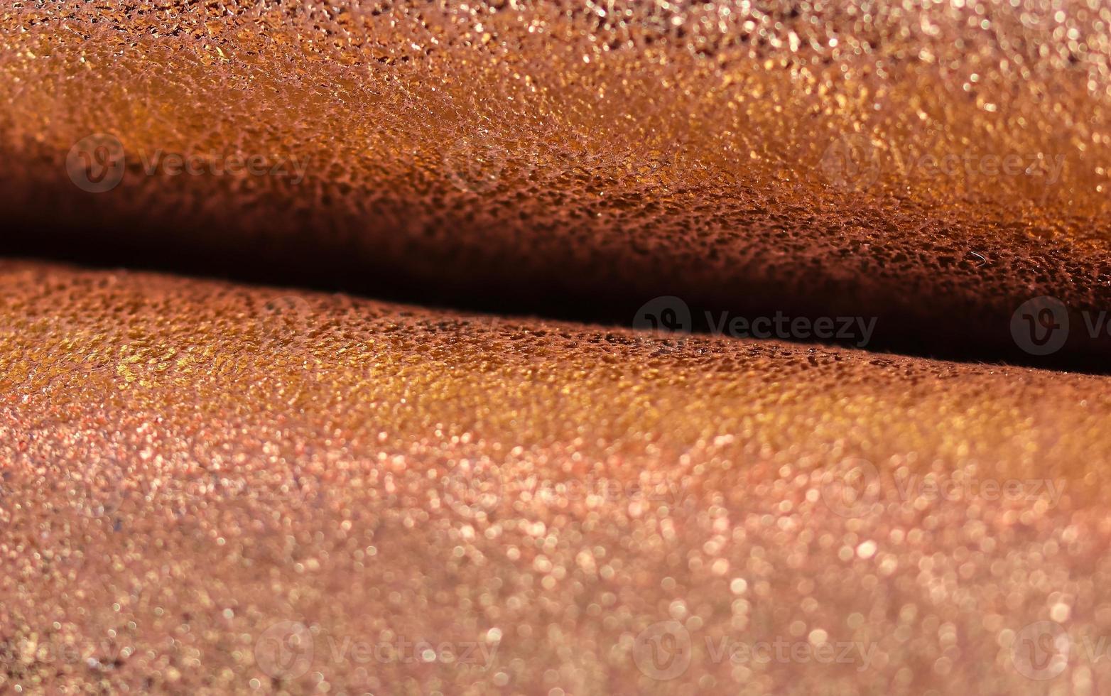 Detailed close up view on samples of cloth and fabrics in different colors found at a fabrics market photo