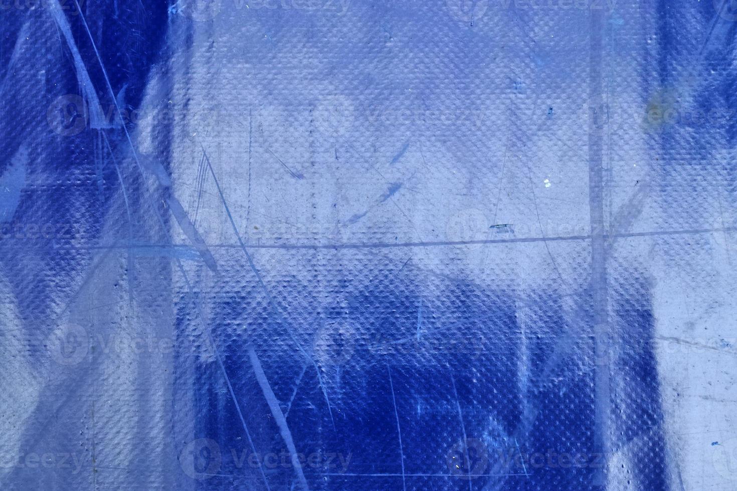 Detailed close up view on samples of cloth and fabrics in different colors found at a fabrics market photo