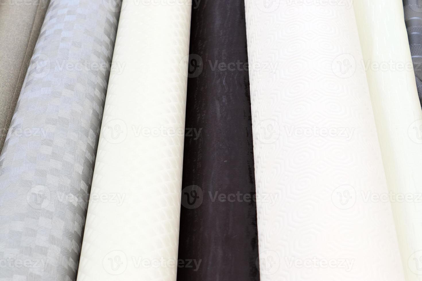 Detailed close up view on samples of cloth and fabrics in different colors found at a fabrics market photo